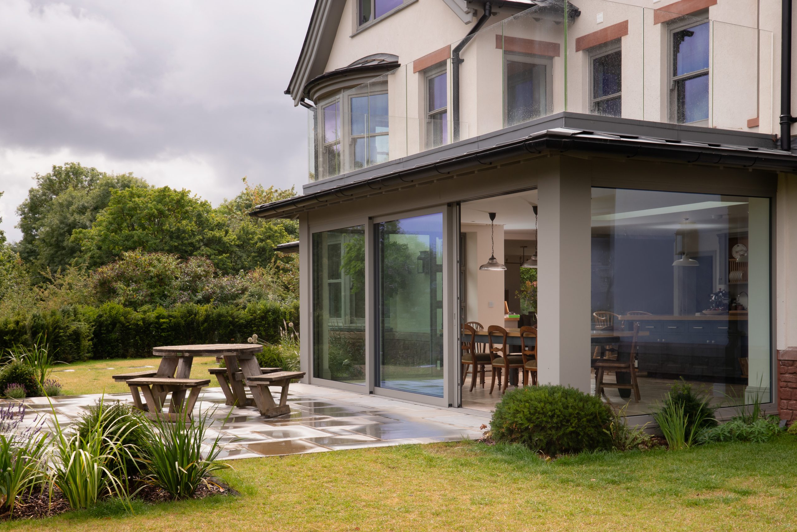 Stone grey lift and slide sliding doors in traditional property