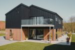 Devon new build featuring lift and slide doors, aluminium windows and curtain walling
