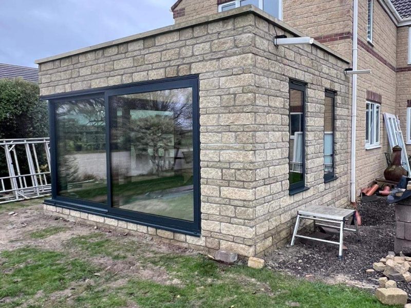 Reynaers MasterPatio Open Corner Lift and Slide Door with Cortizo Aluminium Windows